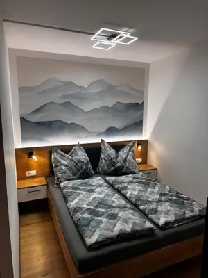 Ein Bett oder Betten in einem Zimmer der Unterkunft Alpenblick - Ferienwohnung Vockner