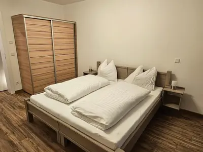 Ein Bett oder Betten in einem Zimmer der Unterkunft Gröbming apartman