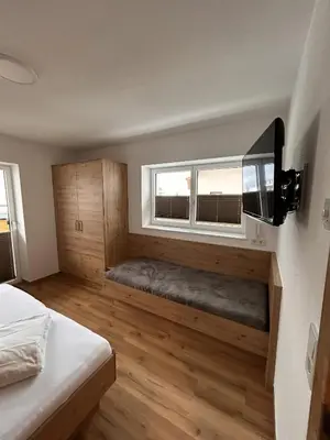 Ein Bett oder Betten in einem Zimmer der Unterkunft Höller's Bergleben