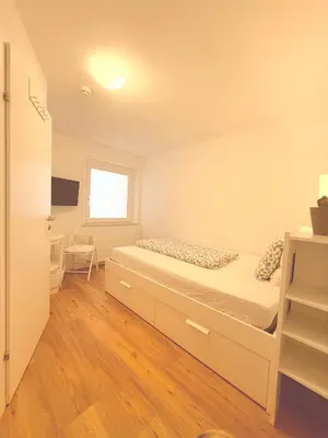 Ein Bett oder Betten in einem Zimmer der Unterkunft Guesthouse Fuschlsee
