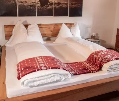 Ein Bett oder Betten in einem Zimmer der Unterkunft Artlieb Hütte