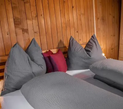 Ein Bett oder Betten in einem Zimmer der Unterkunft Artlieb Hütte