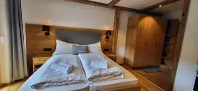 Ein Bett oder Betten in einem Zimmer der Unterkunft Bergidyll 8 by Alpenidyll Apartments