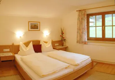 Ein Bett oder Betten in einem Zimmer der Unterkunft Appartmenthaus Geroldhof