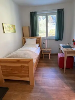 Ein Bett oder Betten in einem Zimmer der Unterkunft Gesäuse-Zimmer