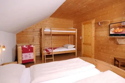 Ein Bett oder Betten in einem Zimmer der Unterkunft Almdorf Katschberg