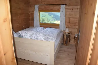 Ein Bett oder Betten in einem Zimmer der Unterkunft Achtchalet