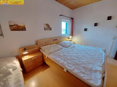 Ein Bett oder Betten in einem Zimmer der Unterkunft Apartment Grimmingsuite