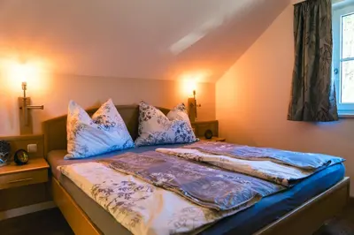 Ein Bett oder Betten in einem Zimmer der Unterkunft Ferienwohnung Kahlseneck