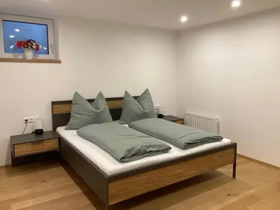 Ein Bett oder Betten in einem Zimmer der Unterkunft FamilienAppartement Waldstüberl