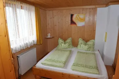 Ein Bett oder Betten in einem Zimmer der Unterkunft Hoamatlhütte