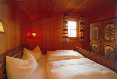 Ein Bett oder Betten in einem Zimmer der Unterkunft Vordergottschallalm