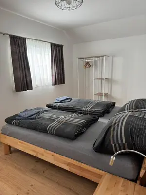 Ein Bett oder Betten in einem Zimmer der Unterkunft Ski und Wander Ferienhäuser Galsterberg-Blick Pruggern - Schladming-Dachstein