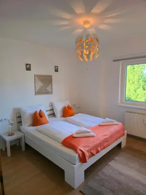 Ein Bett oder Betten in einem Zimmer der Unterkunft Ferienwohnung Walcher