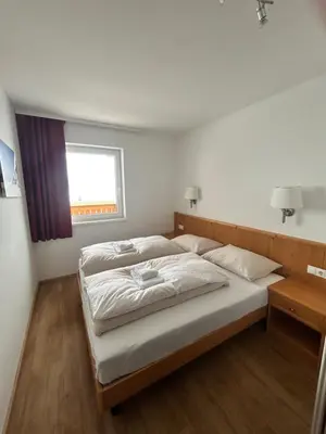 Ein Bett oder Betten in einem Zimmer der Unterkunft FREJA Tauern Apartments by Langeder
