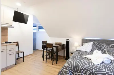 Ein Bett oder Betten in einem Zimmer der Unterkunft Appartements Gasthaus Eichholzer