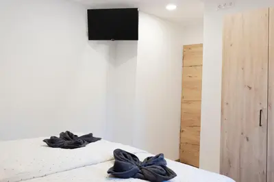 Ein Bett oder Betten in einem Zimmer der Unterkunft Appartements Gasthaus Eichholzer