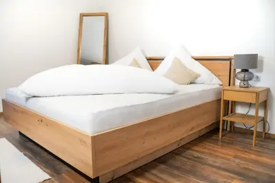 Ein Bett oder Betten in einem Zimmer der Unterkunft Dili Appartement