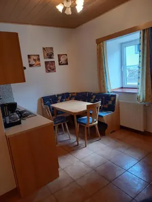 Ein Sitzbereich in der Unterkunft Gasthof Muster-Stüberl