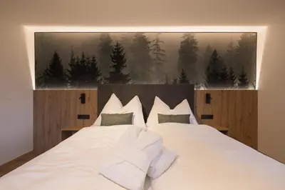 Ein Bett oder Betten in einem Zimmer der Unterkunft Hochthron Suites