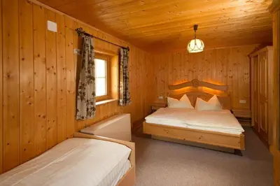 Ein Bett oder Betten in einem Zimmer der Unterkunft Gottschallalm
