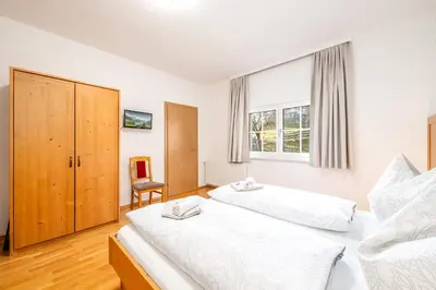 Ein Bett oder Betten in einem Zimmer der Unterkunft Stieglerhof Bergrefugium & Kaiblingblick - by myNests