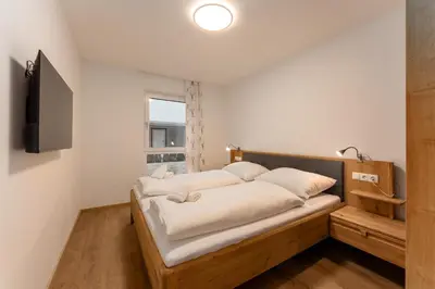 Ein Bett oder Betten in einem Zimmer der Unterkunft Enns Collection Planai West by Schladming-Appartements
