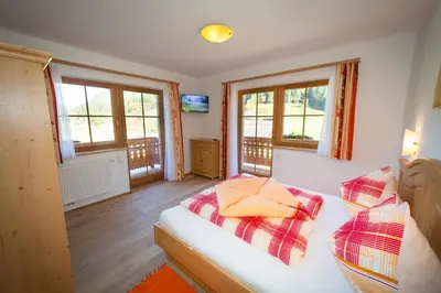 Ein Bett oder Betten in einem Zimmer der Unterkunft Rojerhof
