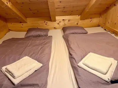 Ein Bett oder Betten in einem Zimmer der Unterkunft Hütte Monigold