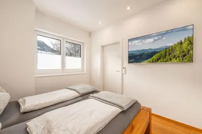 Ein Bett oder Betten in einem Zimmer der Unterkunft Apartment Höchstein - Stone & Light Residence - by myNests