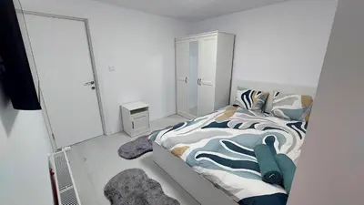 Ein Bett oder Betten in einem Zimmer der Unterkunft Moonriver Alps Ski Apartament