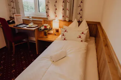 Ein Bett oder Betten in einem Zimmer der Unterkunft Panorama Hotel Leidingerhof