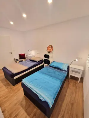 Ein Bett oder Betten in einem Zimmer der Unterkunft Newworkcenter Apartmenthaus