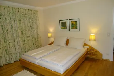 Ein Bett oder Betten in einem Zimmer der Unterkunft Ferienwohnung Grünwald