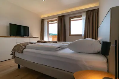 Ein Bett oder Betten in einem Zimmer der Unterkunft Apartments Waldrand - Fink 6 - by myNests