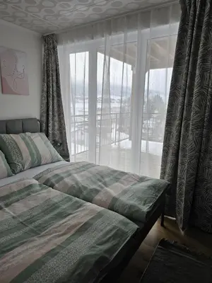 Ein Bett oder Betten in einem Zimmer der Unterkunft Naturnah & gemütlich - Feriennest mit Bergkulisse
