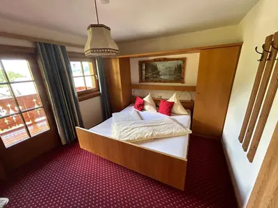 Ein Bett oder Betten in einem Zimmer der Unterkunft Blashof seit 1693 - Apartments Schladming