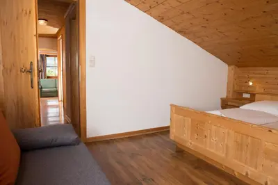 Ein Bett oder Betten in einem Zimmer der Unterkunft Glonerbauer Apartment