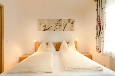 Ein Bett oder Betten in einem Zimmer der Unterkunft Appartements Hitzenbichler