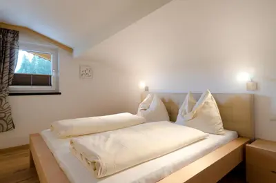 Ein Bett oder Betten in einem Zimmer der Unterkunft Appartements Hitzenbichler