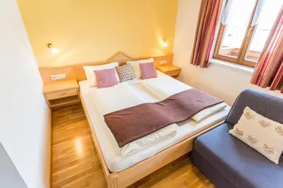 Ein Bett oder Betten in einem Zimmer der Unterkunft Ausserraingut