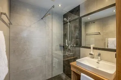 Ein Badezimmer in der Unterkunft Aparthotel Weningeralm