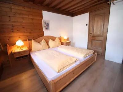 Ein Bett oder Betten in einem Zimmer der Unterkunft Sprawling Mansion near Ski Area in Salzburg