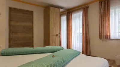 Ein Bett oder Betten in einem Zimmer der Unterkunft Peterlhaus