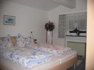 Ein Bett oder Betten in einem Zimmer der Unterkunft Ferienhaus Marianne
