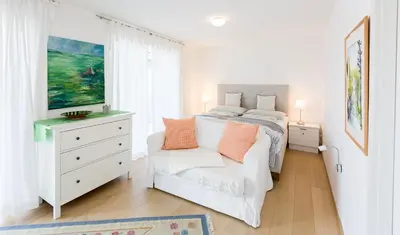 Ein Bett oder Betten in einem Zimmer der Unterkunft Apartments Villa Traunseeblick