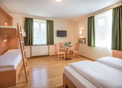 Ein Bett oder Betten in einem Zimmer der Unterkunft JUFA Hotel Altaussee