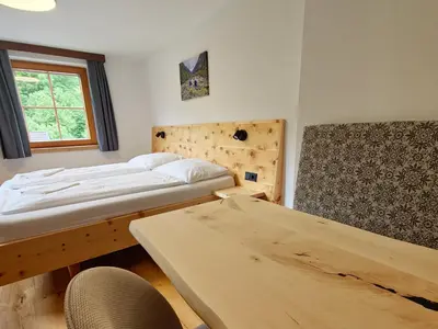 Ein Bett oder Betten in einem Zimmer der Unterkunft Landhotel Lacknerhof