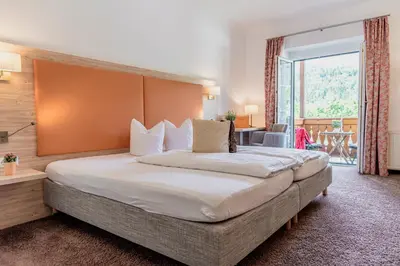 Ein Bett oder Betten in einem Zimmer der Unterkunft Wohlfühlhotel Goiserer Mühle
