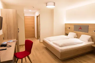 Ein Bett oder Betten in einem Zimmer der Unterkunft Hotel Rosner